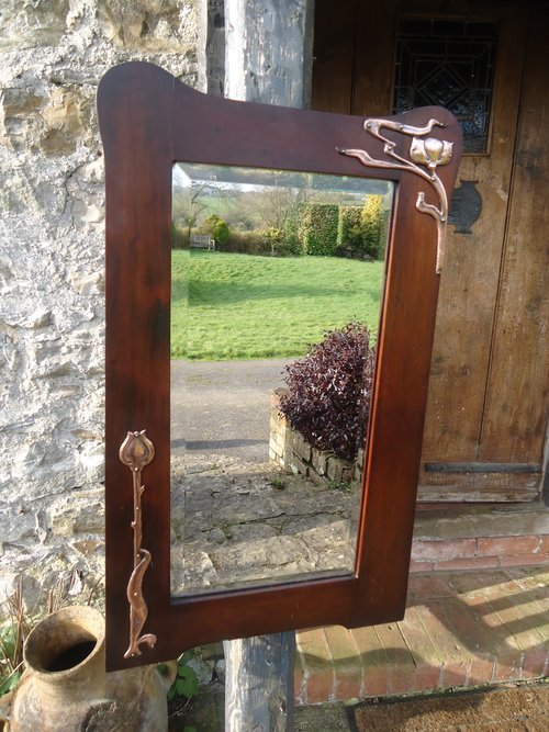 Arts & Crafts mirror with copper flowers