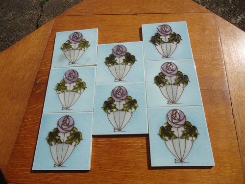 Lovely set of Eight Arts & Crafts tube lined tiles