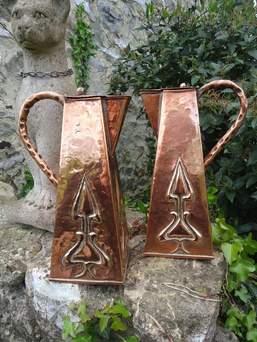 Pair of Arts & Crafts Glasgow school lidded jugs