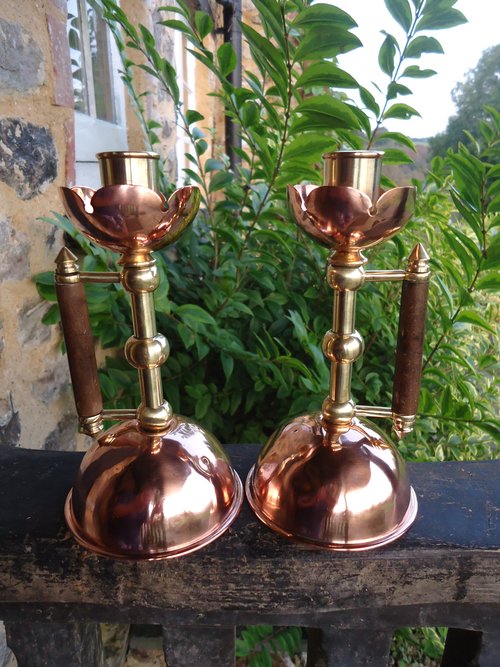 Pair of Arts & Crafts candlestick . Dresser