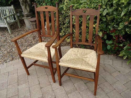 Pair of Arts & Crafts oak armchairs for Liberty