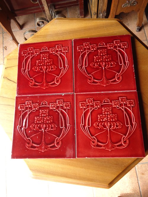 Set of four Arts & Crafts maroon tiles