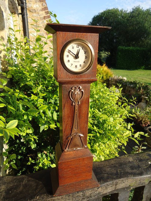 Small Arts & Crafts oak clock with copper overlay