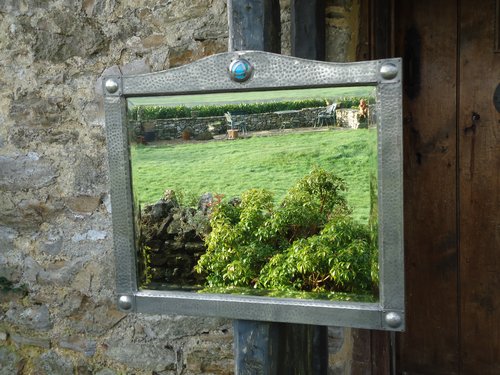 Superb Arts & Crafts pewter mirror with cabochon