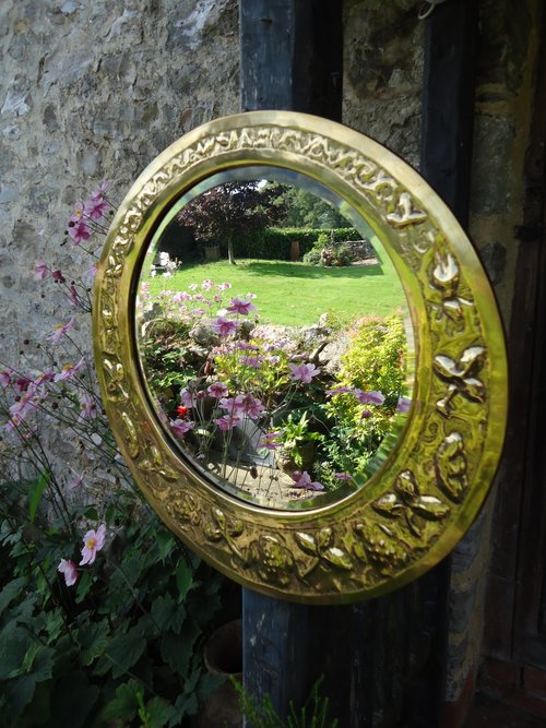 Unusual Arts & Crafts brass mirror