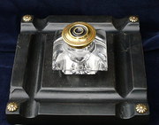 Pressed glass inkwell on an eb