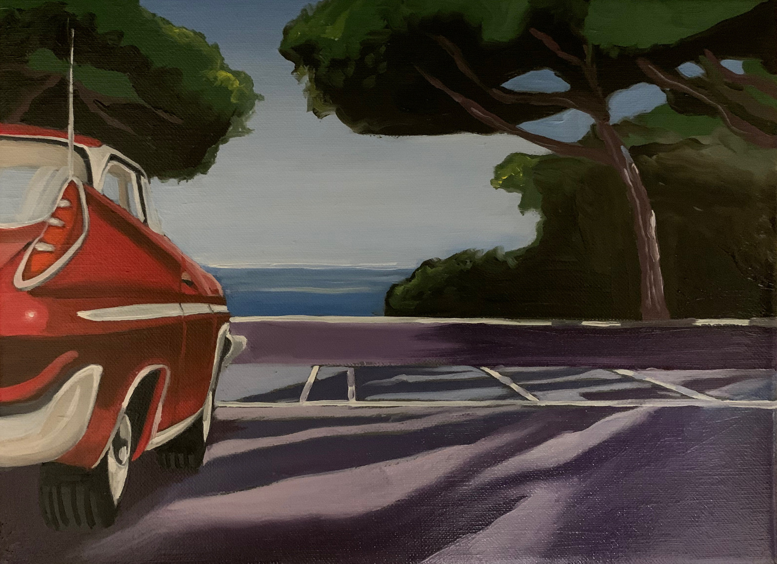 Red car at the beach
