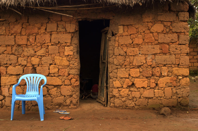 Blue chair against red wall - Angola