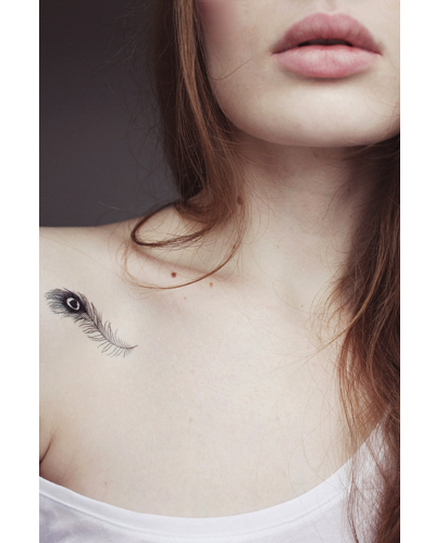 Small feather tattoo