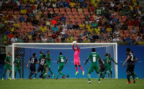 Nigeria's goalkeeper Daniel grabs the ball during the Rio 2016 Olympic Games mens First Round Group B football match Nigeria vs Japan, at the Amazonia Arena in Manaus on August 4, 2016. / AFP PHOTO / RAPHAEL ALVES