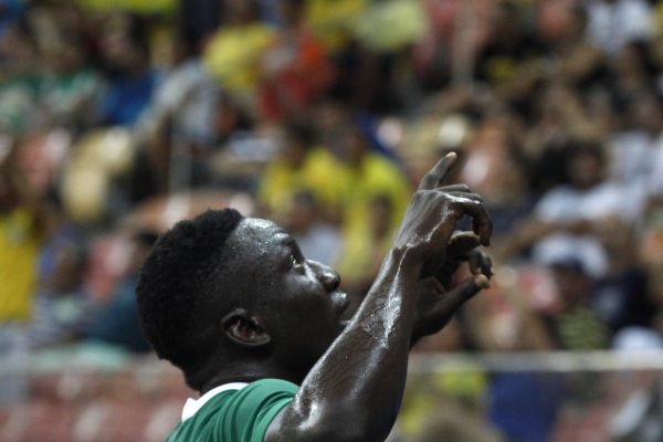 Nigeria's player Oghenekaro Etebo (8) celebrates his fourth goal during the Rio 2016 Olympic Games mens First Round Group B football match Nigeria vs Japan, at the Amazonia Arena in Manaus on August 4, 2016. / AFP PHOTO / RAPHAEL ALVES