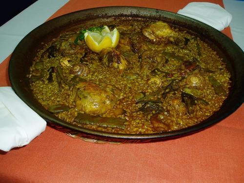 Restaurante en El Palmar paella de pollo ,conejo y pato