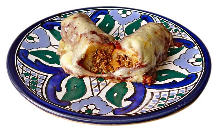 Tamales de mole de guajolote gratinados