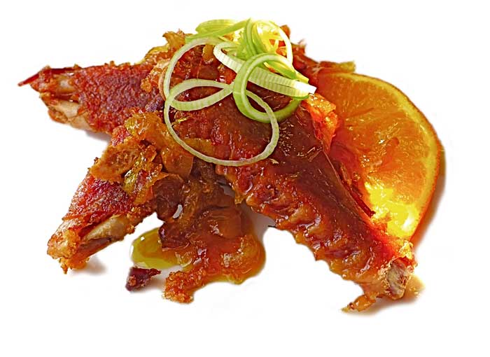 Alitas de pato lacadas en salsa de naranja