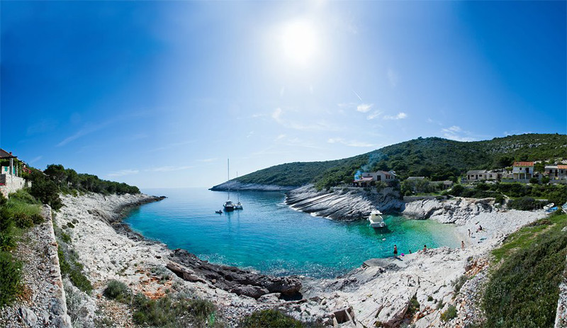 Hired boats anchored in cove Mala Travna at south of island of Vis