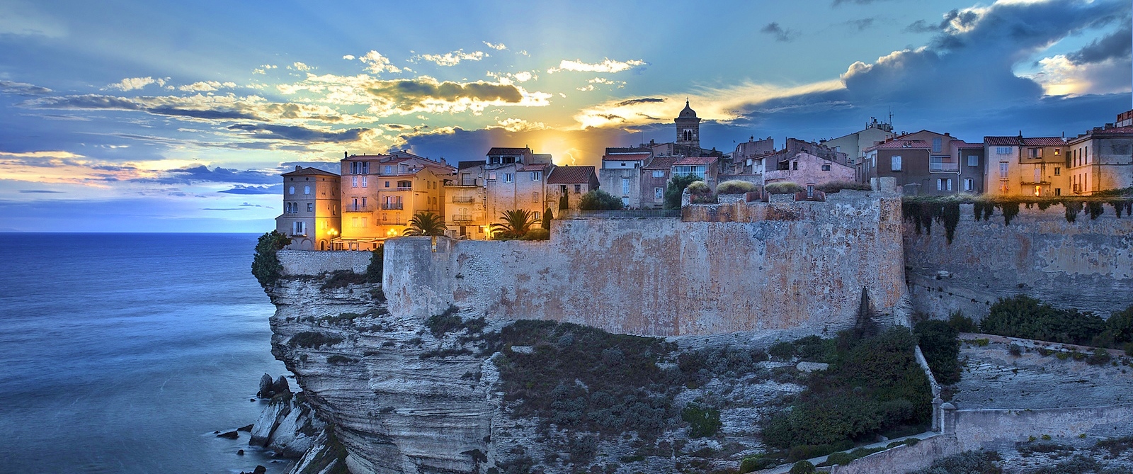 Sunset at the old town of Bonifacio over the cliff (Corsica)