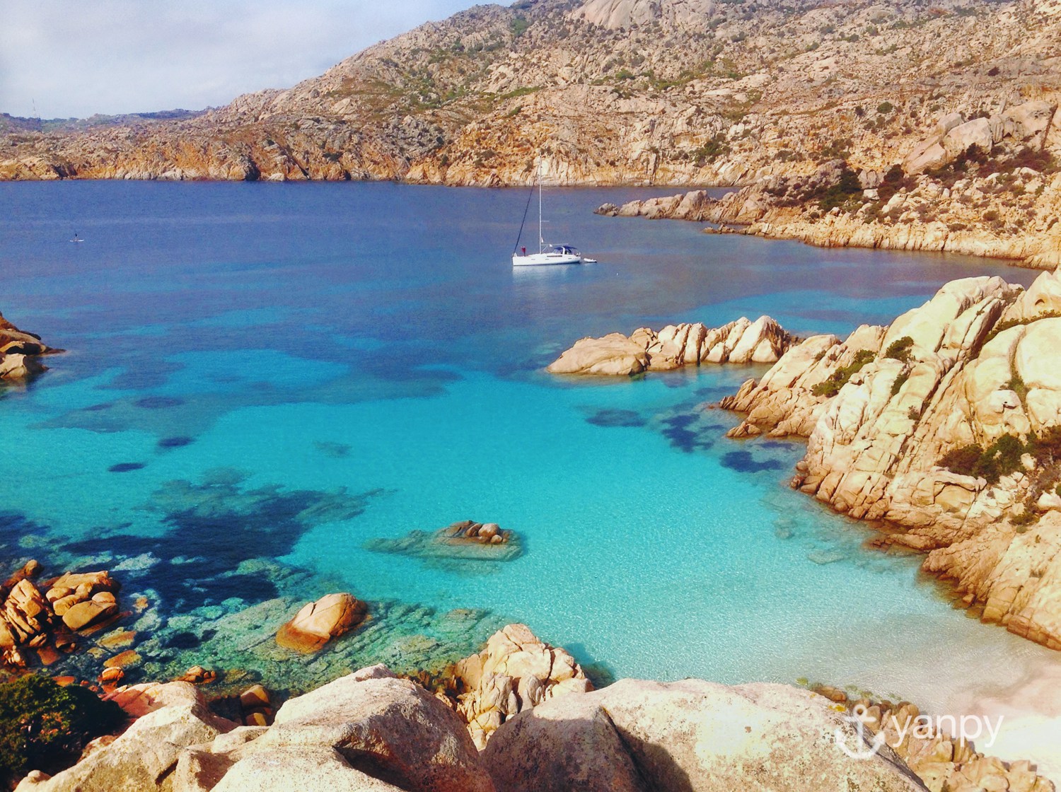 Rental sailboat anchored in cala Coticcio - Caprera, archipelago of La Maddalena (Sardinia)