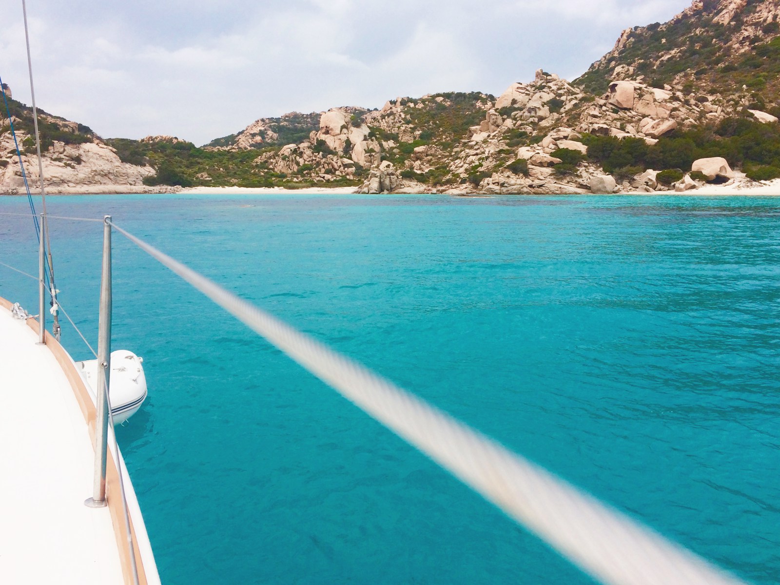 Rental sailboat anchored in cala Corsara, Spargi island (La Maddalena)