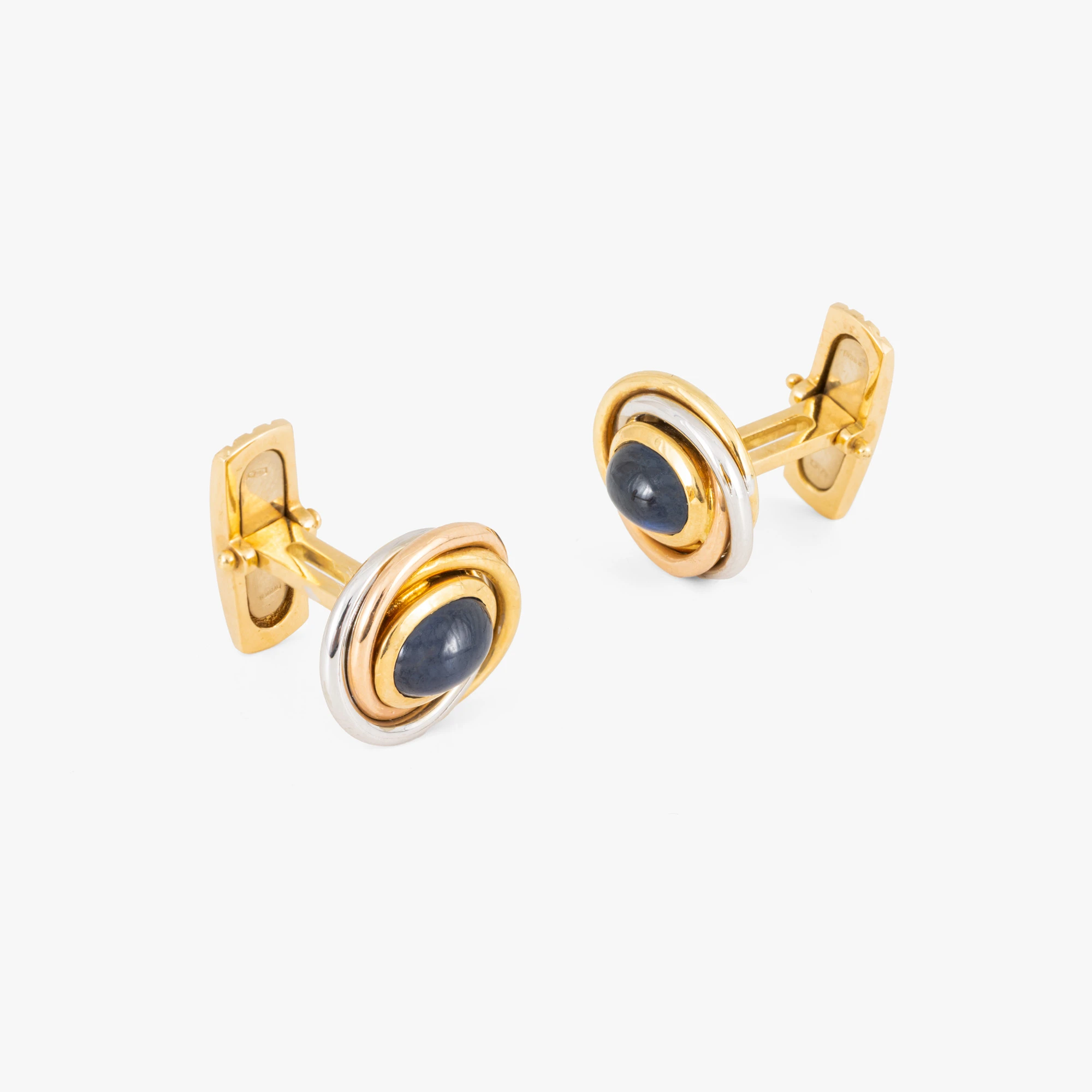 Pair of bicolor gold cufflinks decorated with sapphires