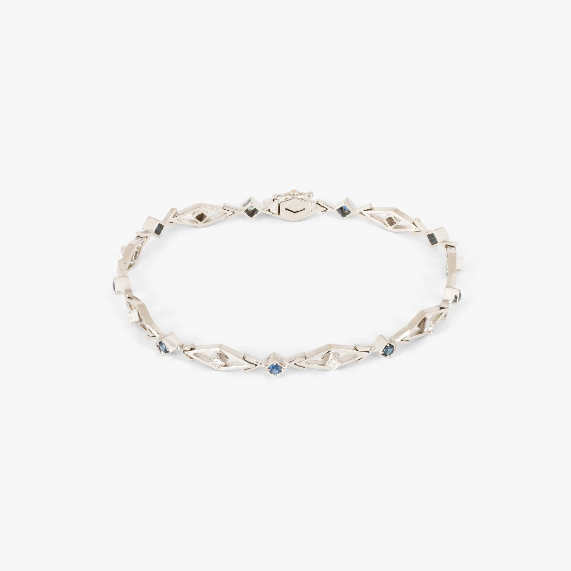 White gold bracelet decorated with alternating diamonds and sapphires