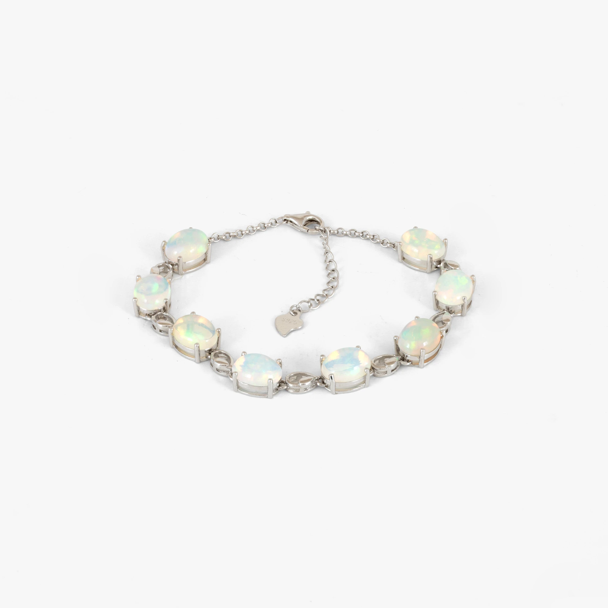 Silver bracelet decorated with opals