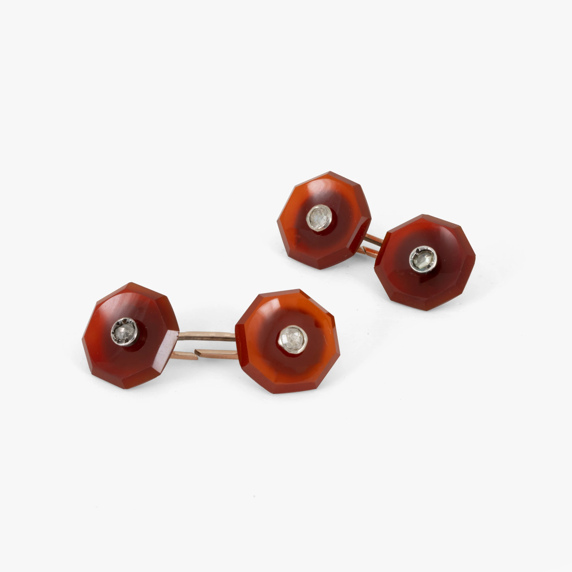 Pair of cufflinks made of red gold and silver, decorated with carnelian and diamonds