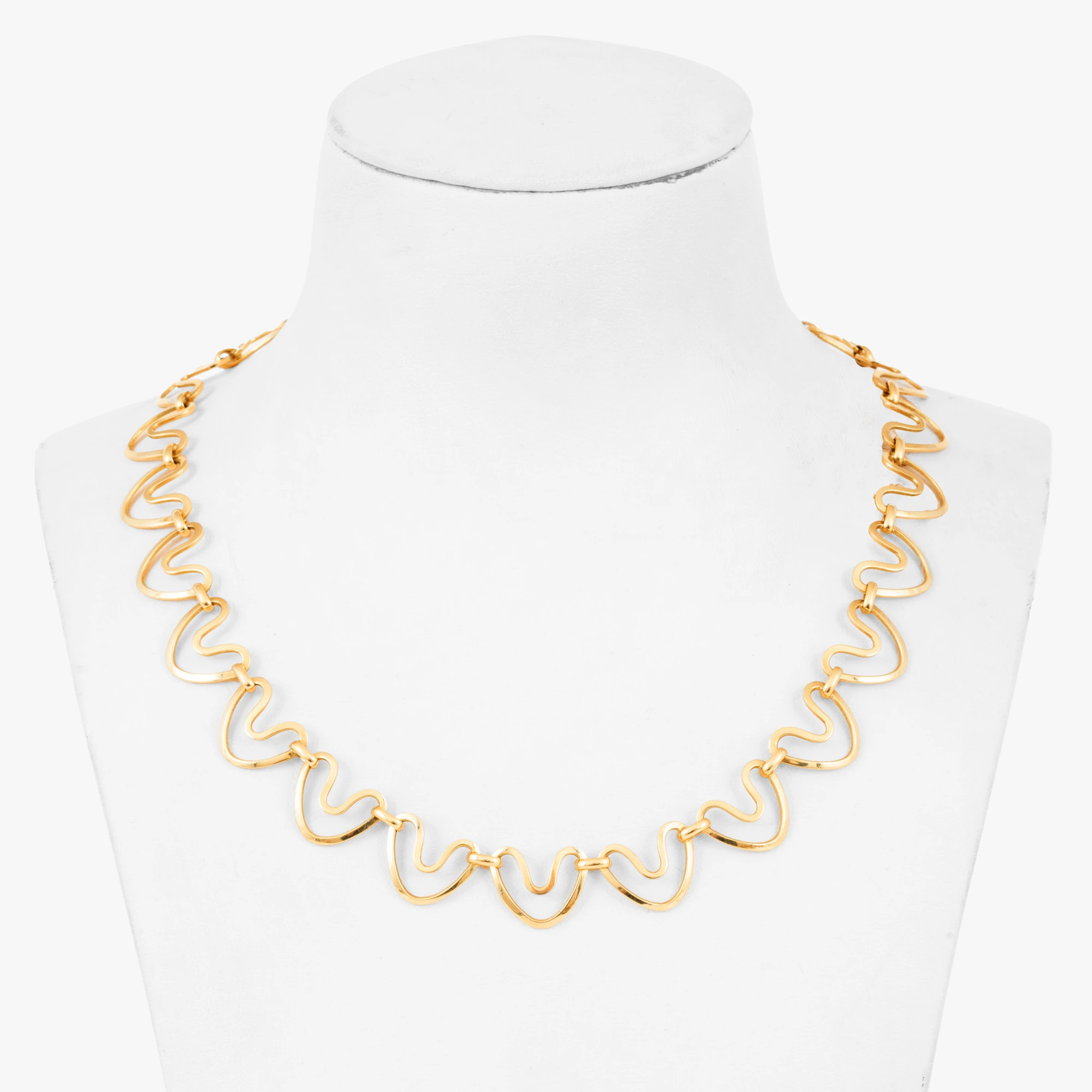 Gold necklace decorated with hearts