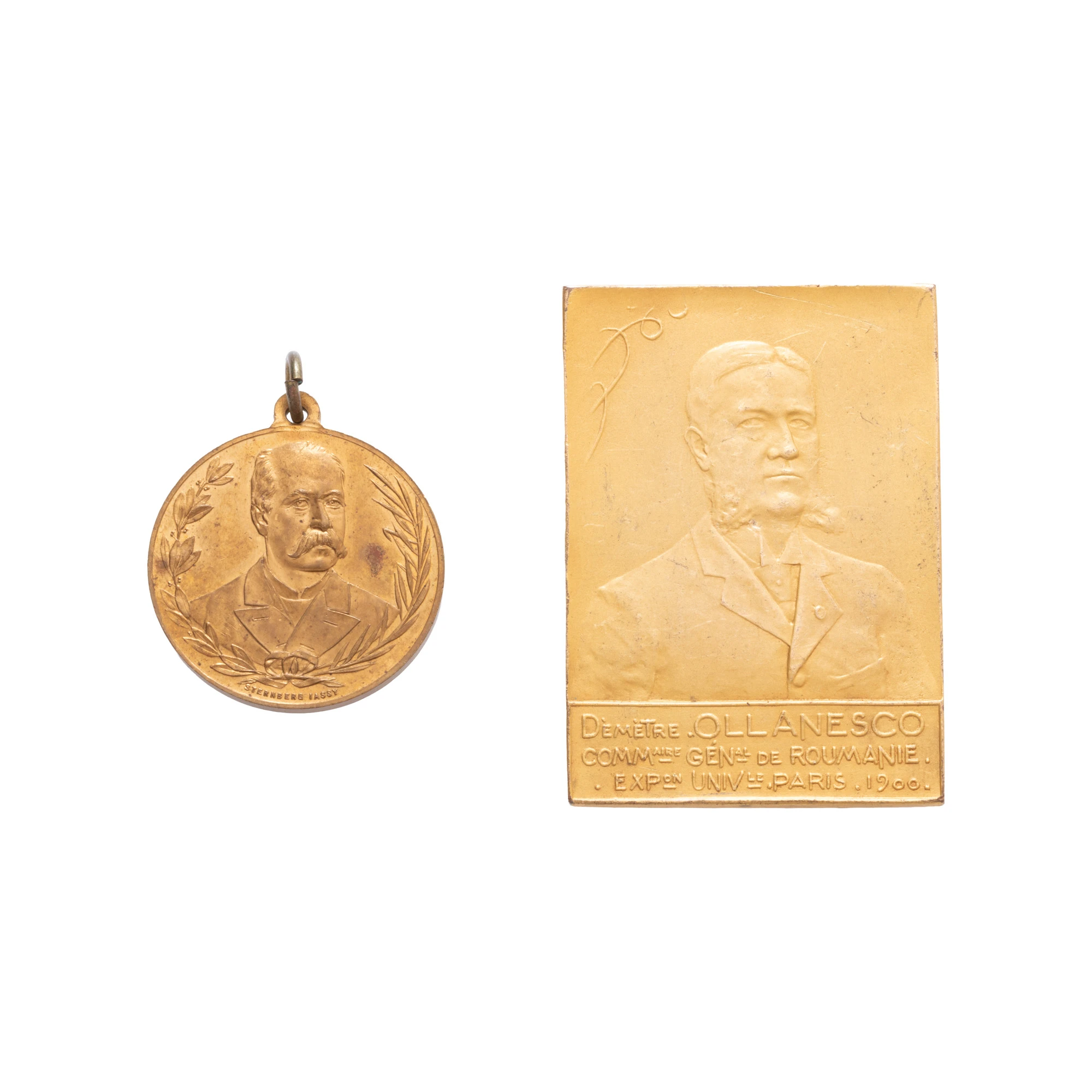 Lot format din placheta ”Dumitru Olănescu, Expoziția universală de la Paris”, 1900, și medalia ”În memoria lui Lascăr Catargiu”, gravor Sternberg, cca. 1899