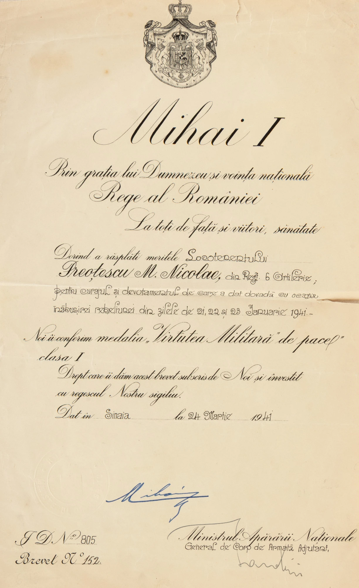 Brevet regal pentru acordarea Medaliei ”Virtutea militară de pace”, clasa I, 24 martie 1941, acordată locotenentului Nicolae M. Preoțescu din Regimentul 6 Artilerie pentru contribuția sa la înăbușirea rebeliunii legionare din 21, 22, 23 ianuarie 1941, cu semnătura olografă a Regelui Mihai I