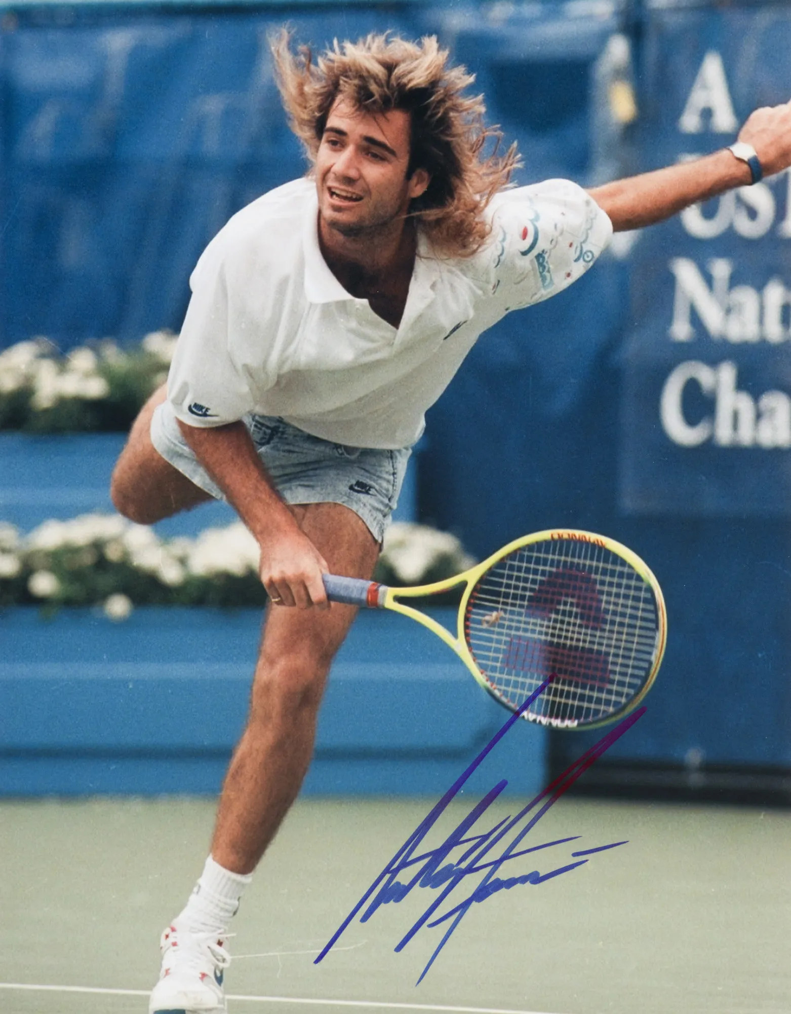 Photograph of Andre Agassi, with his handwritten signature, accompanied by a certificate of authenticity