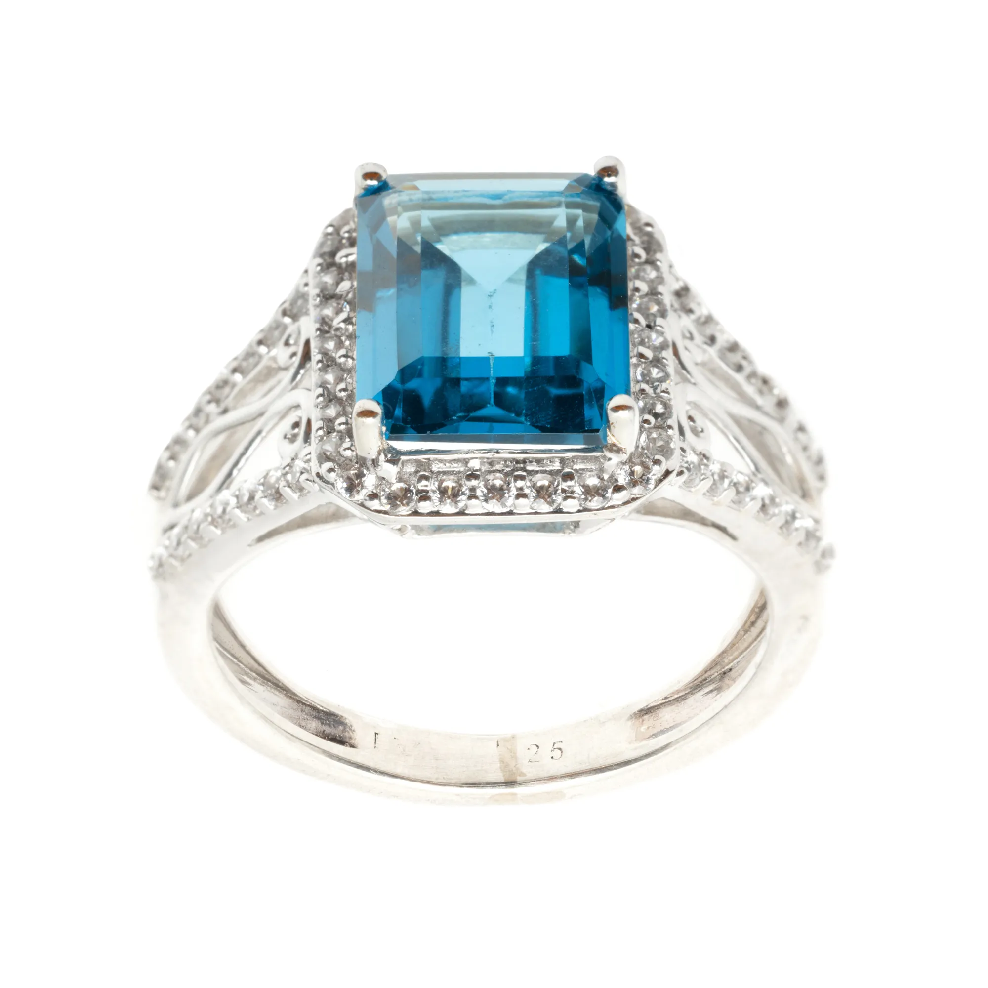 Silver ring decorated with topaz and zircon