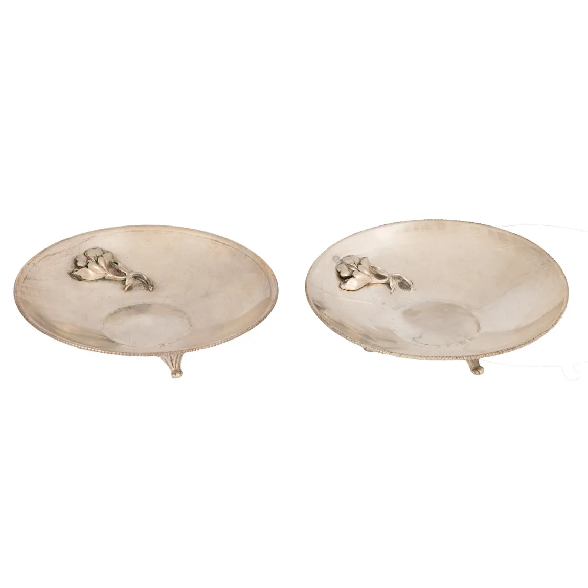 Pair of miniature silver trays, decorated with floral elements in bas-relief