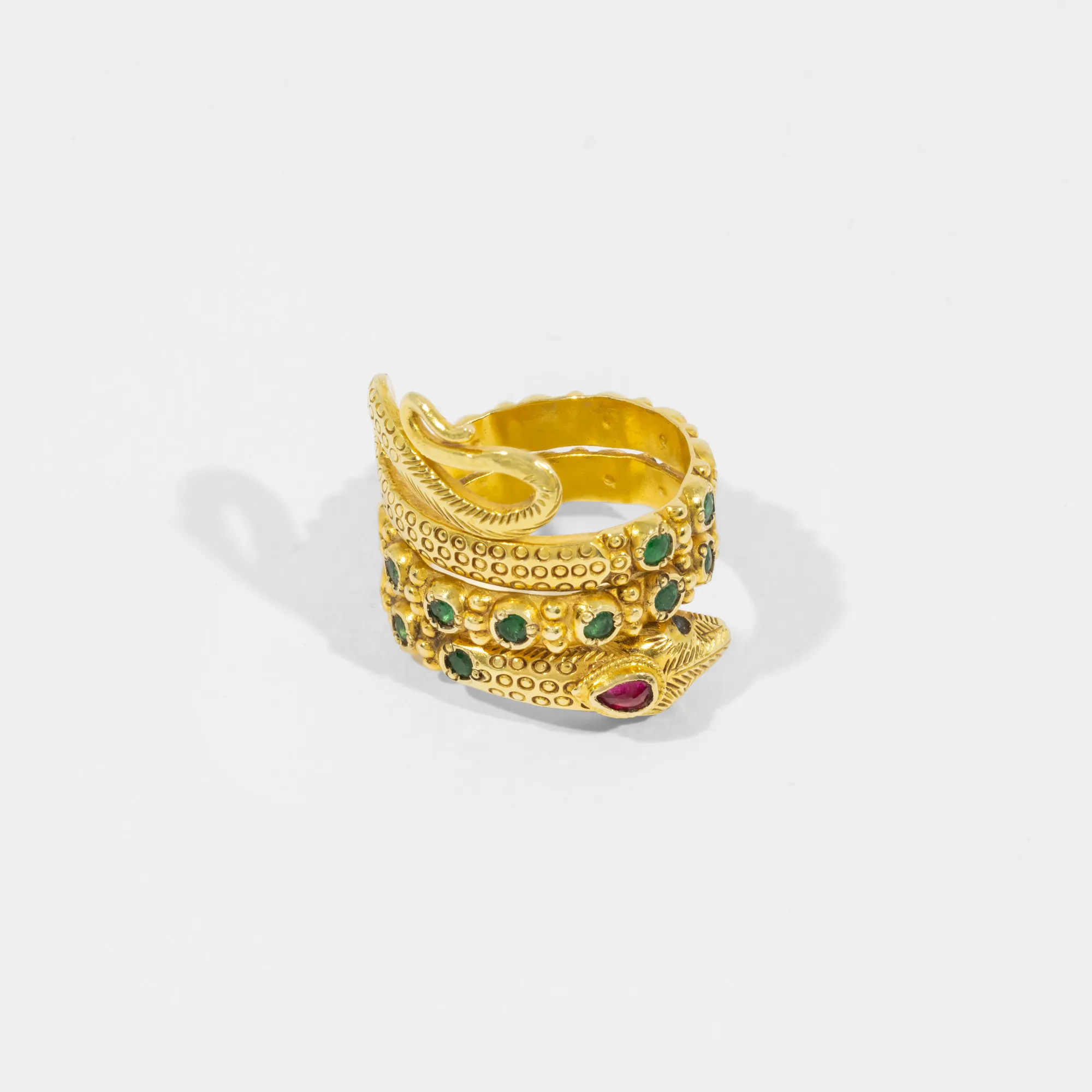 Ring in the shape of a snake, made of gold, encrusted with emeralds, rubies and sapphires