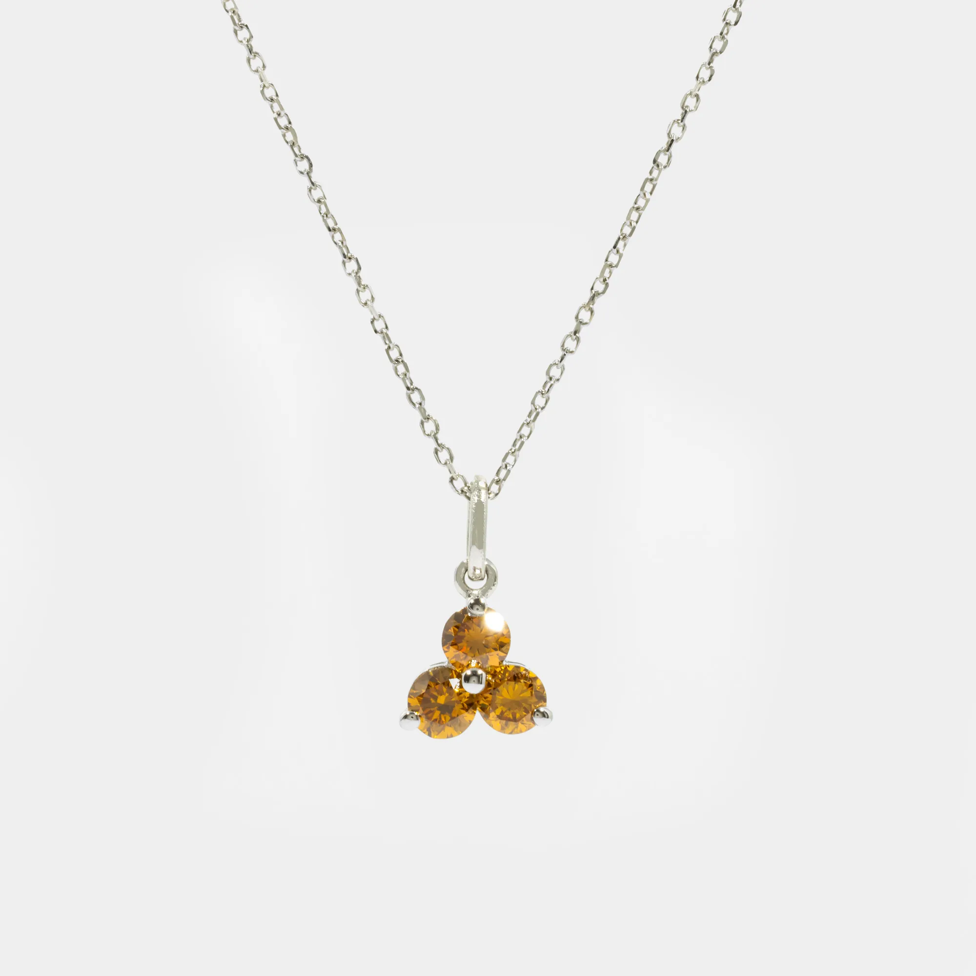 White gold chain with pendant, adorned with three diamonds, accompanied by AGLT gemological certificate