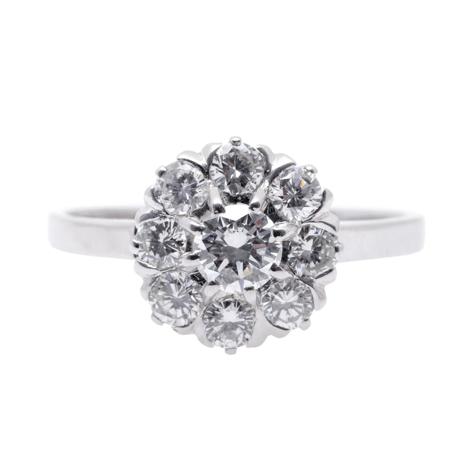 White gold ring in the shape of a flower, decorated with diamonds
