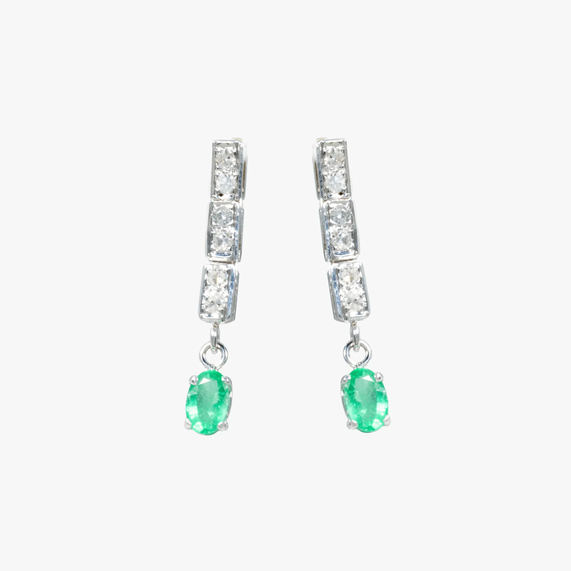Pair of white gold earrings, decorated with diamonds and emeralds