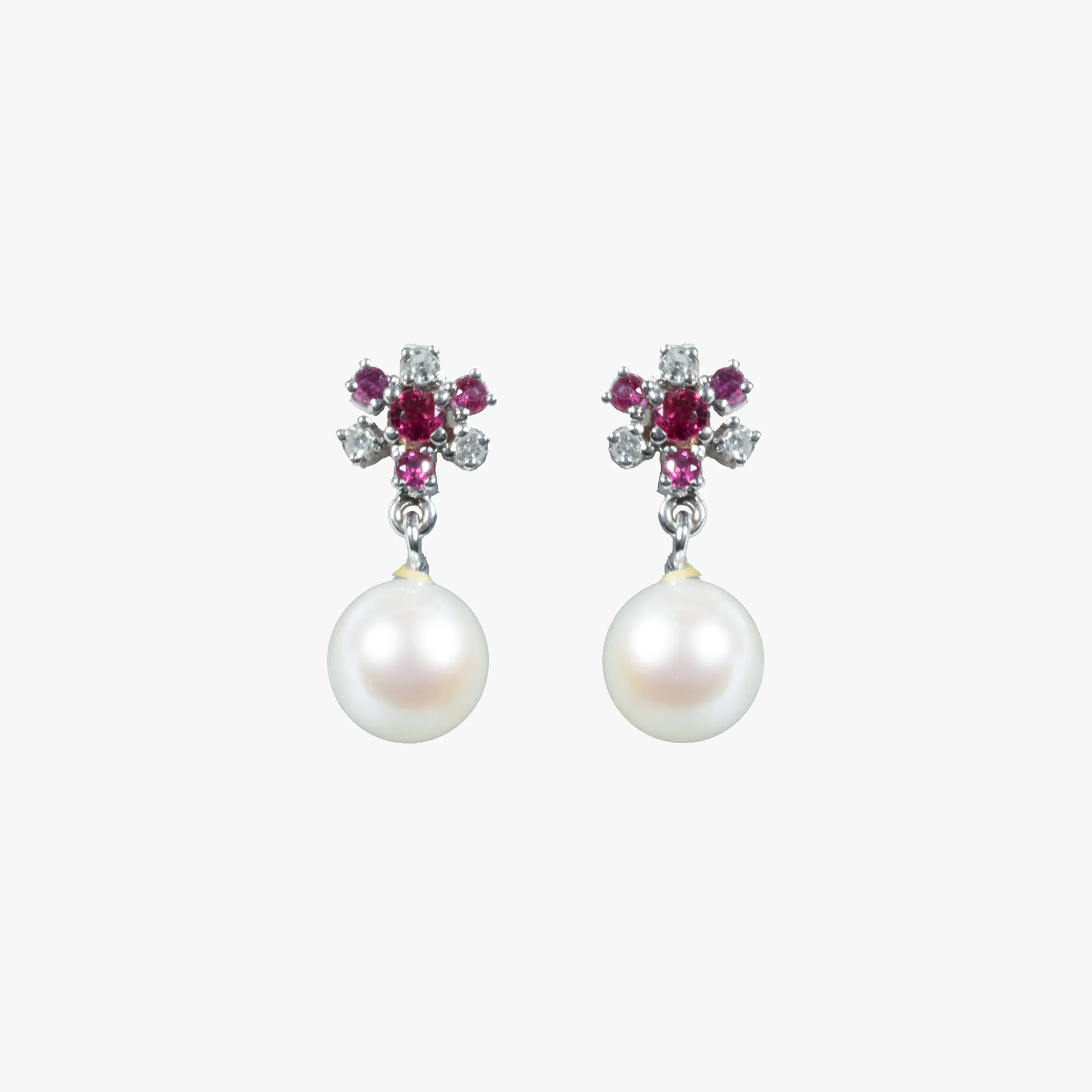 Pair of white gold earrings, decorated with pearls, diamonds and rubies