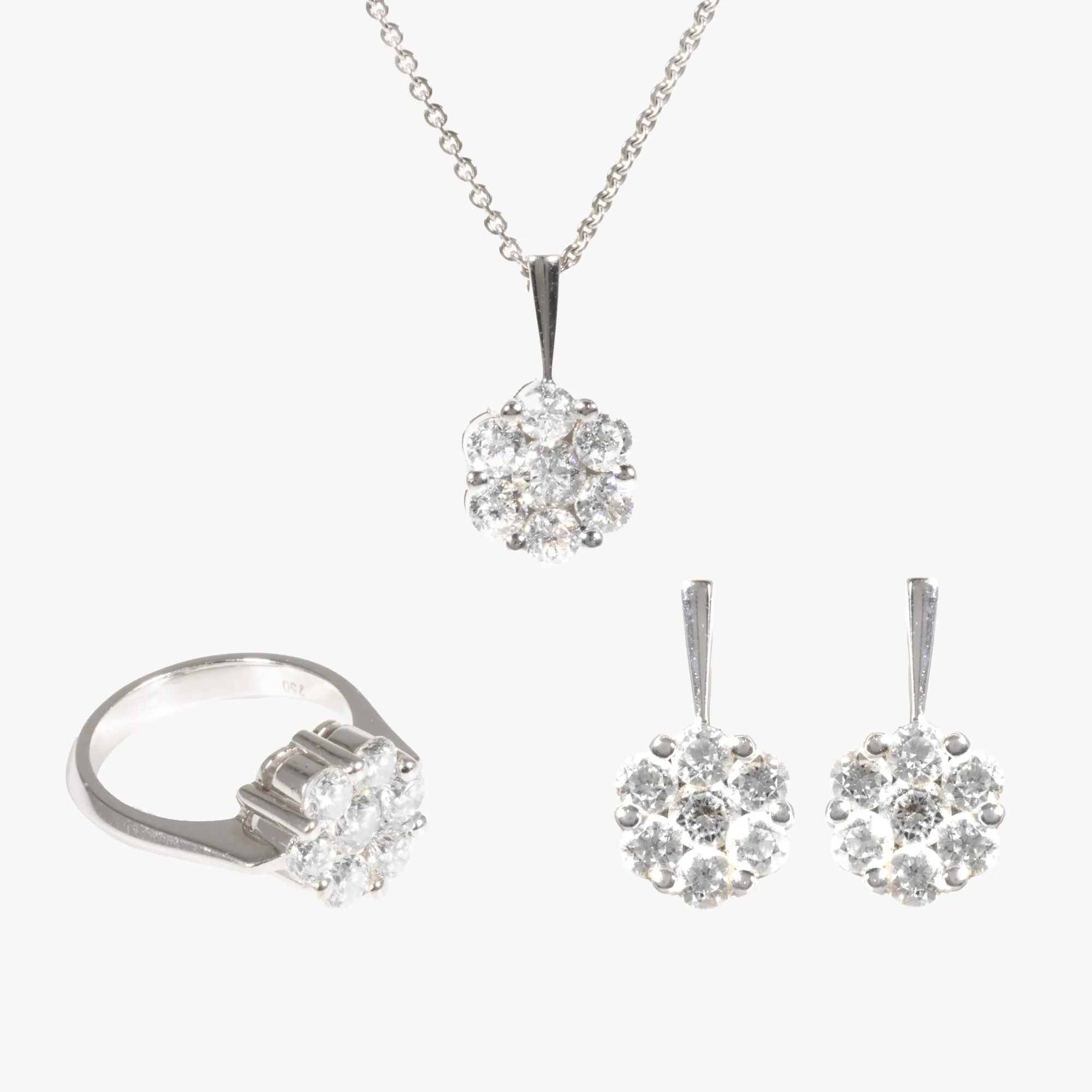 White gold set, consisting of a pair of earrings, pendant chain and ring, decorated with diamonds