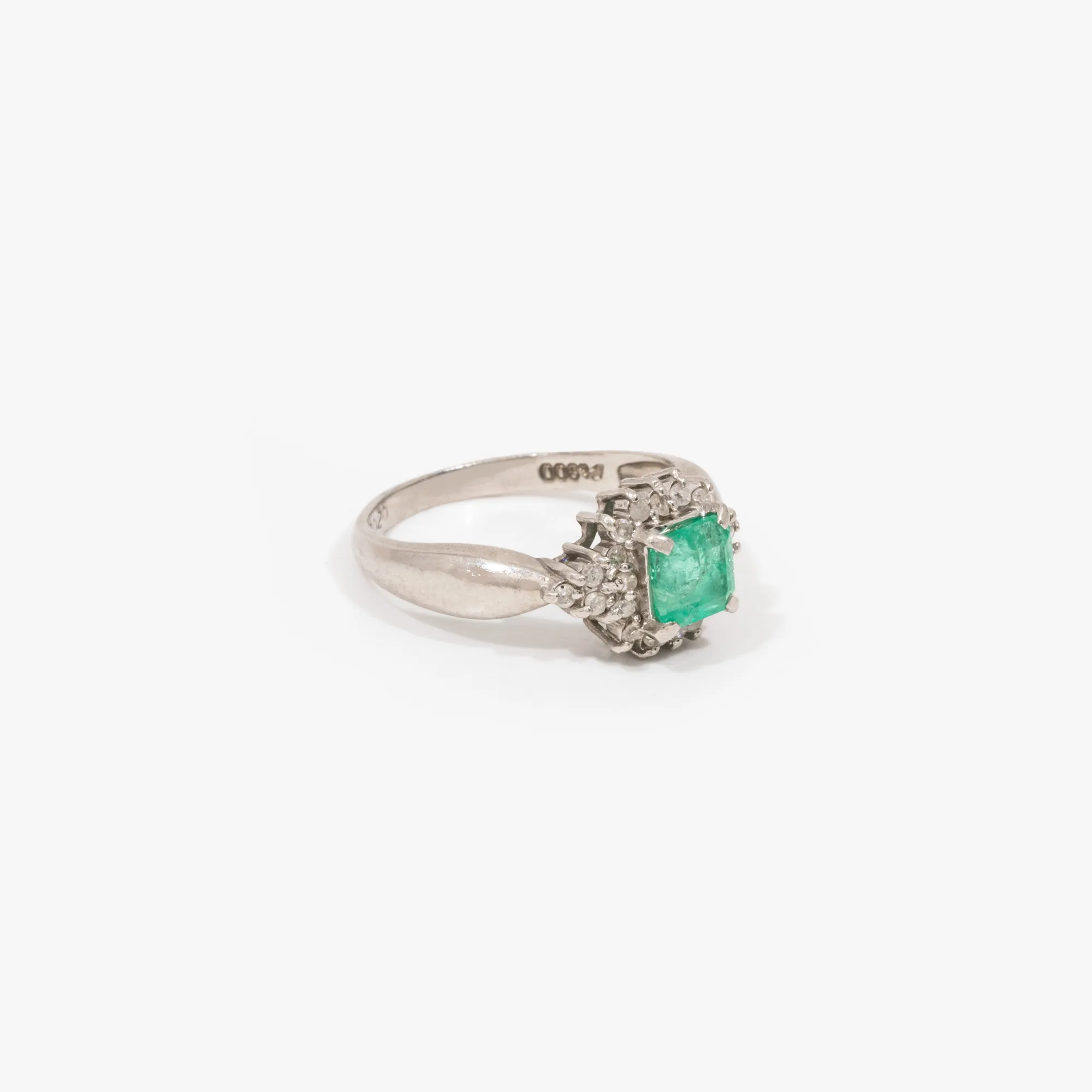 Platinum ring, decorated with emerald and diamonds