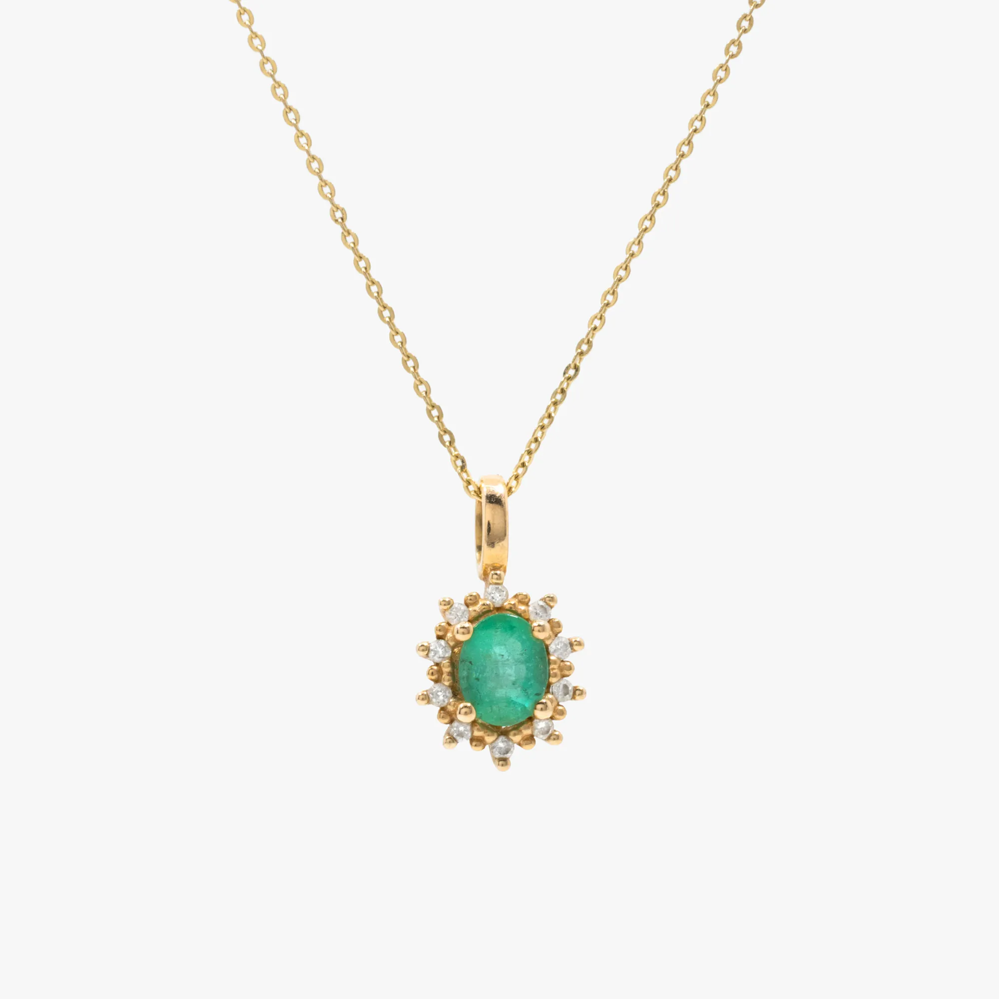 Gold chain with pendant, decorated with emerald and diamonds