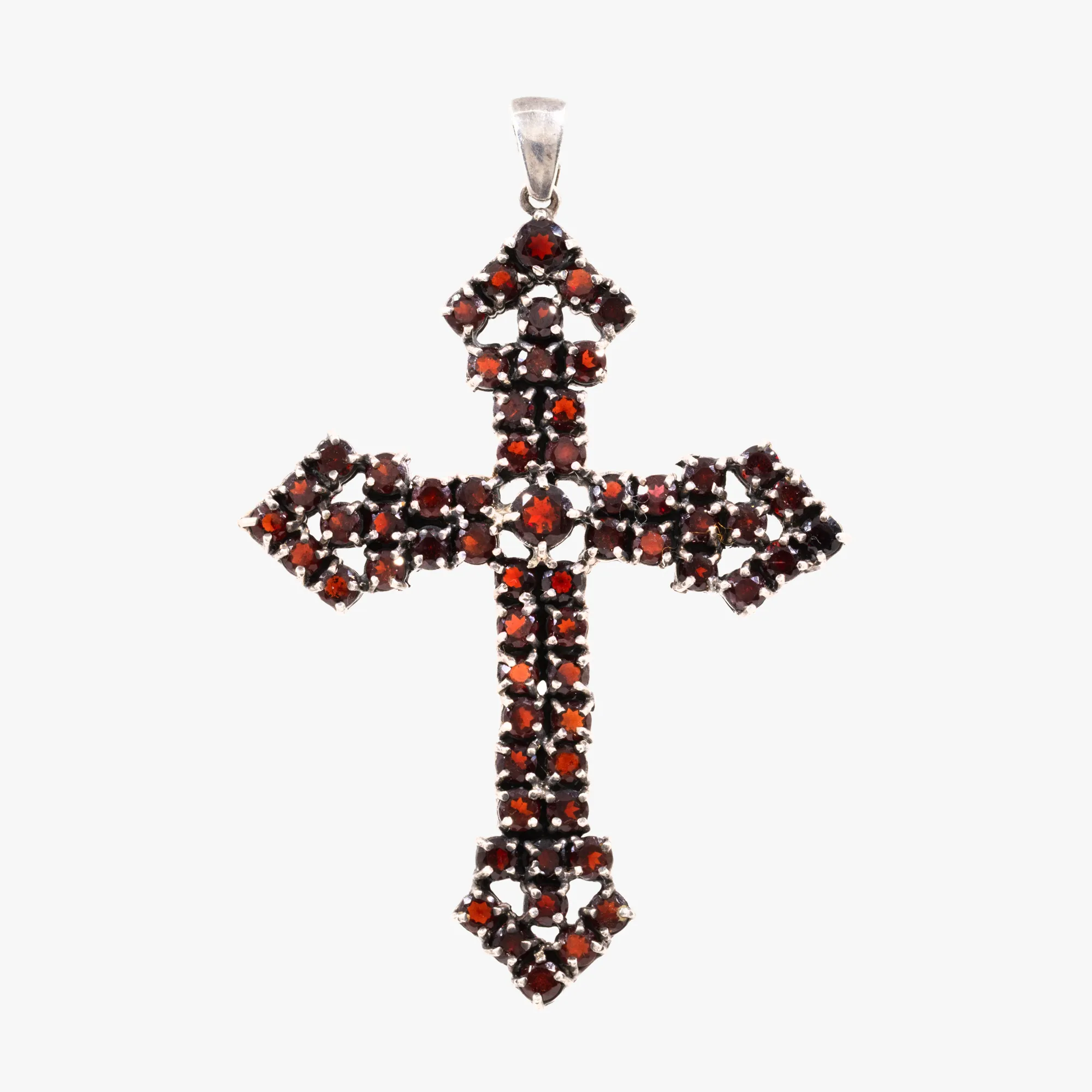 Silver pendant, in the shape of a cross, paved with garnets