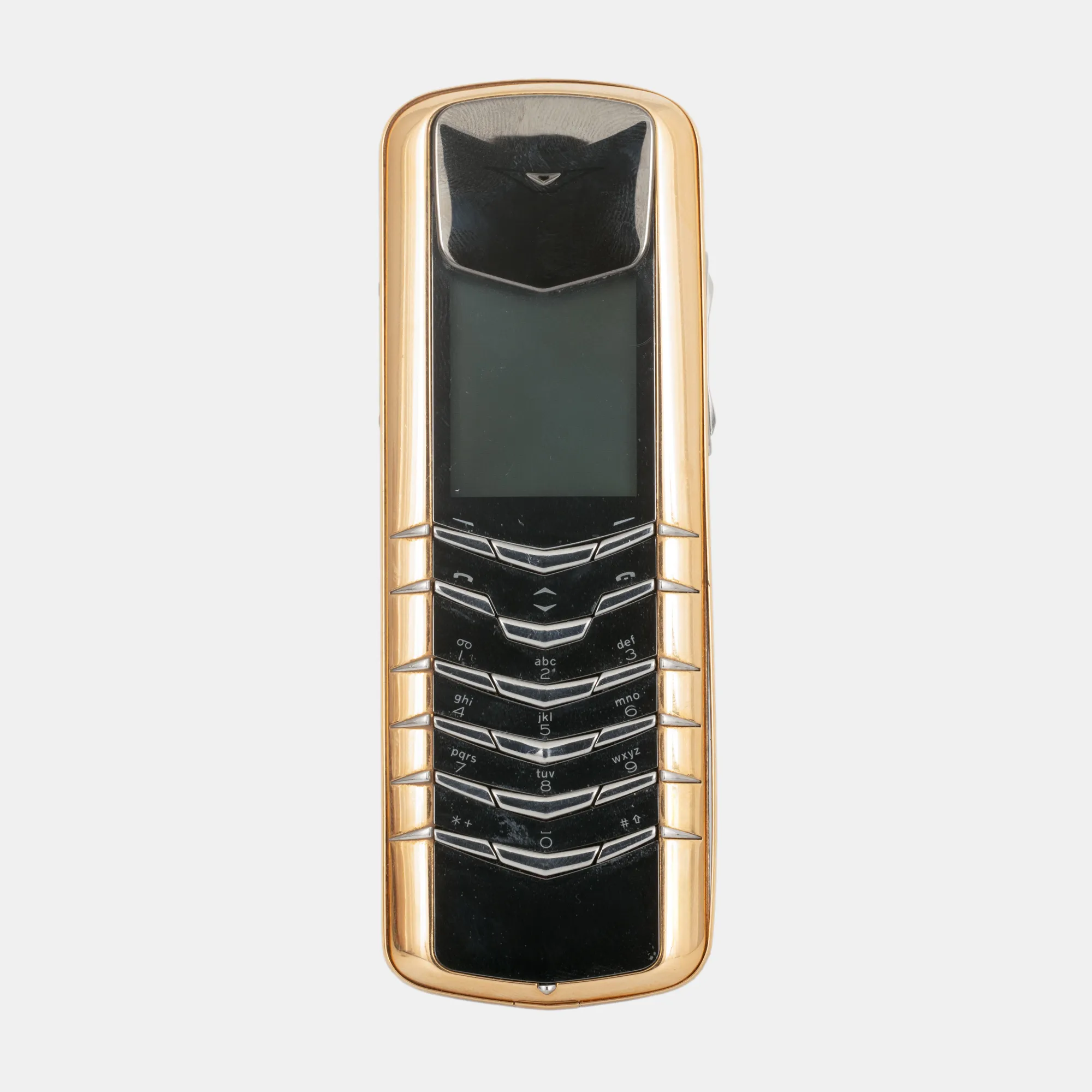 Telefon Vertu, din aur, însoțit de încărcător și cască pentru mașină