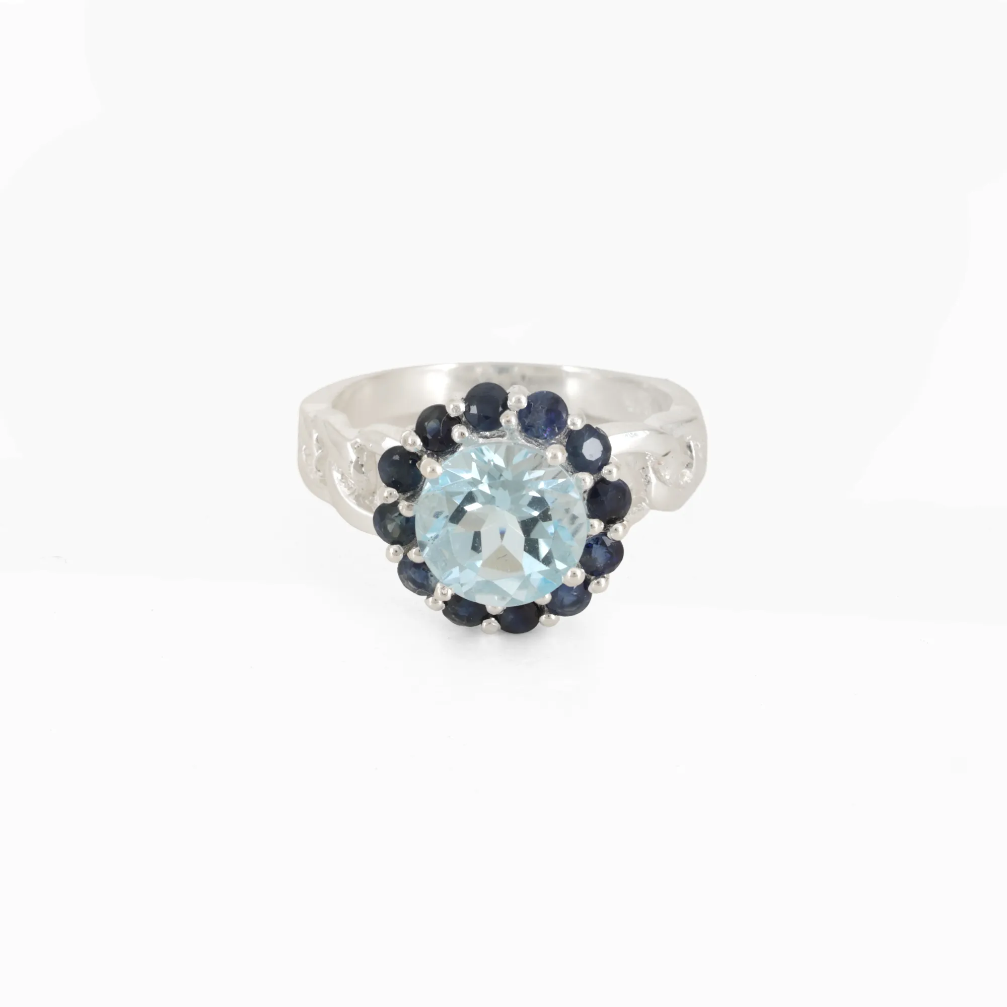 Silver ring, decorated with sapphires and a central topaz
