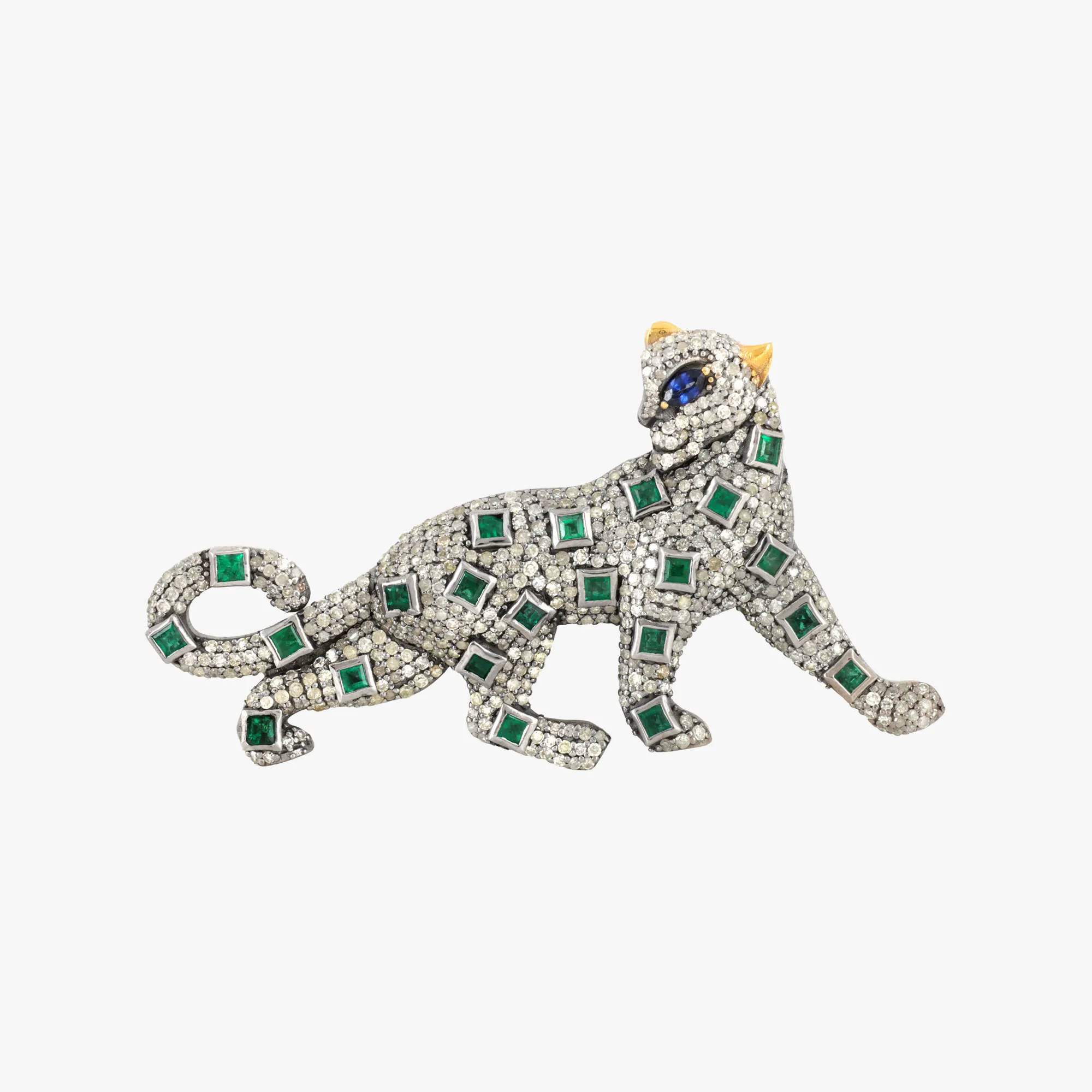 Silver brooch, made in the shape of a panther, decorated with a pavement of diamonds, sapphire and emeralds