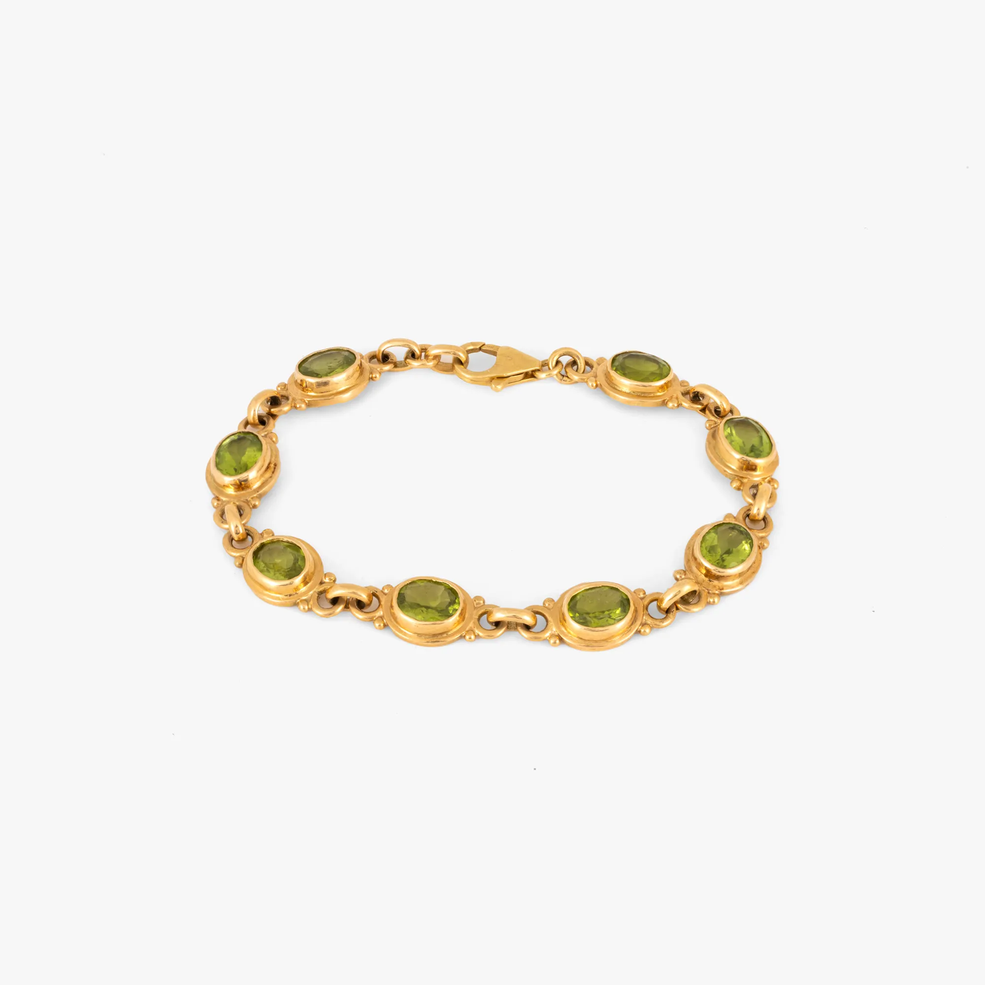 Gold bracelet, decorated with peridots