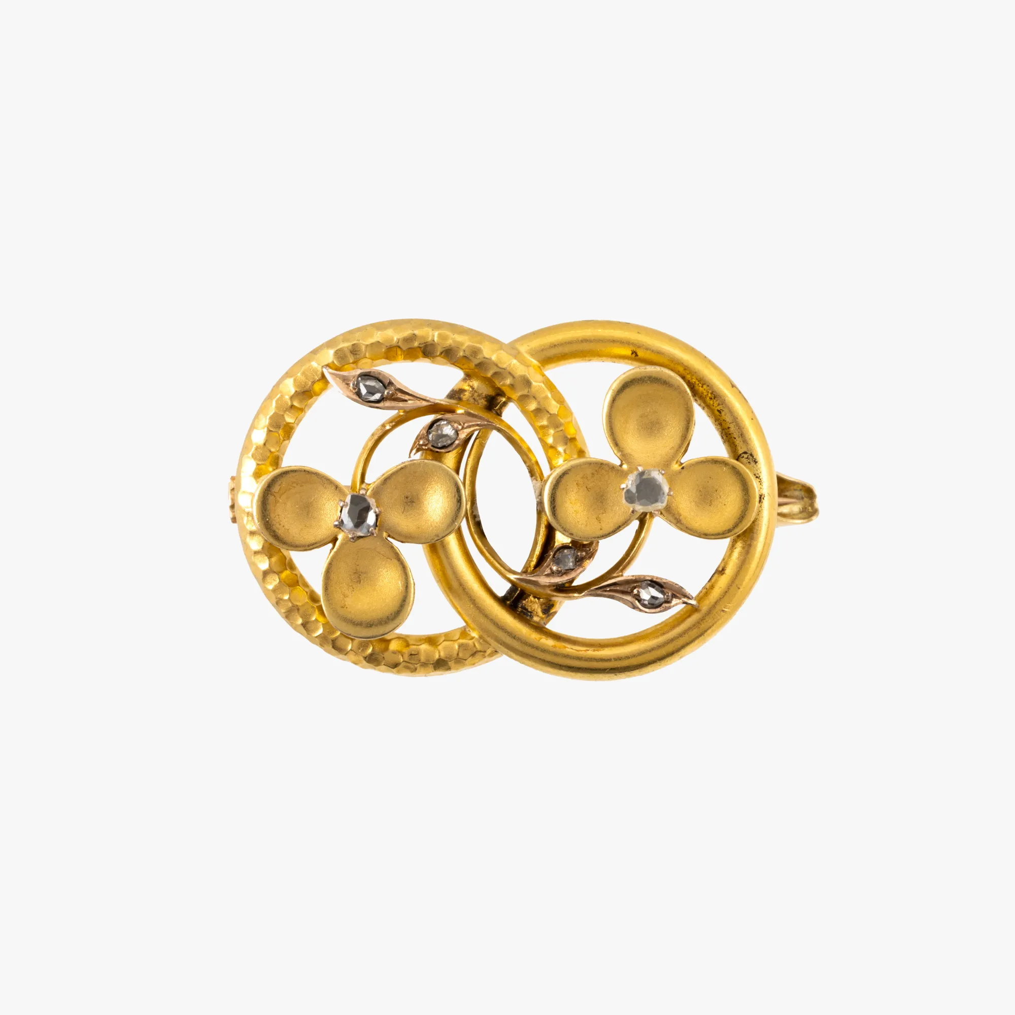 Bicolor gold brooch, made with floral motifs, decorated with diamonds, circa 1900