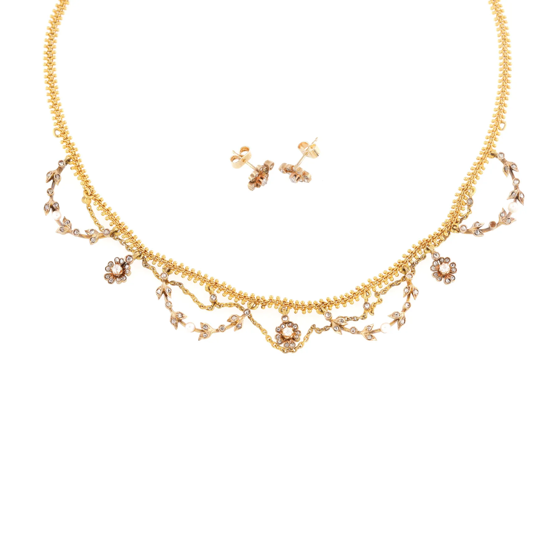 Belle Époque gold demi-parure, consisting of a necklace and a pair of earrings, decorated with diamonds and pearls, circa 1900