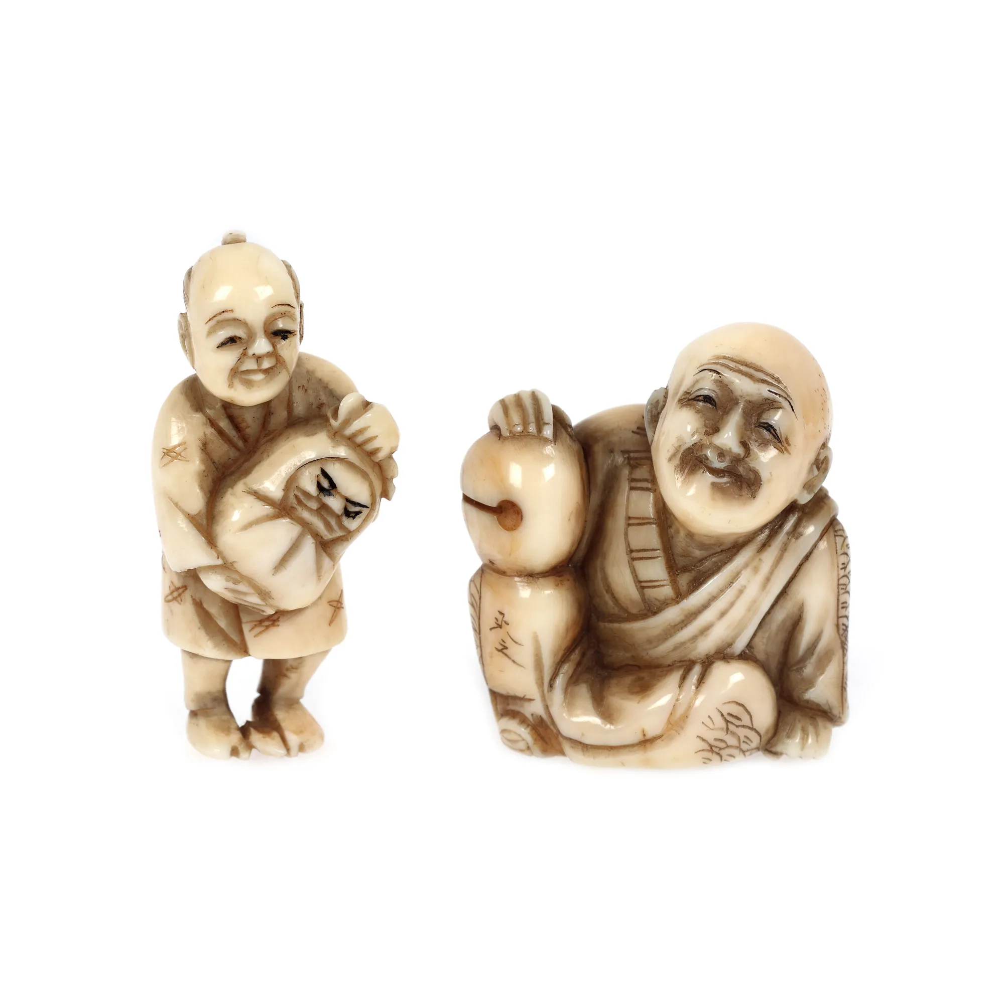 Pair of ivory netsuke, signed, depicting a seated old man and a parent with a child in their arms, Japan, late 19th century