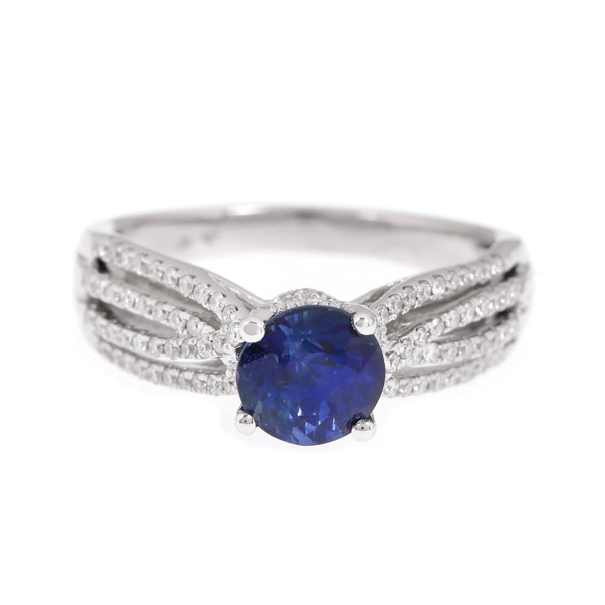 White gold ring, adorned with sapphire and strings of side-by-side diamonds