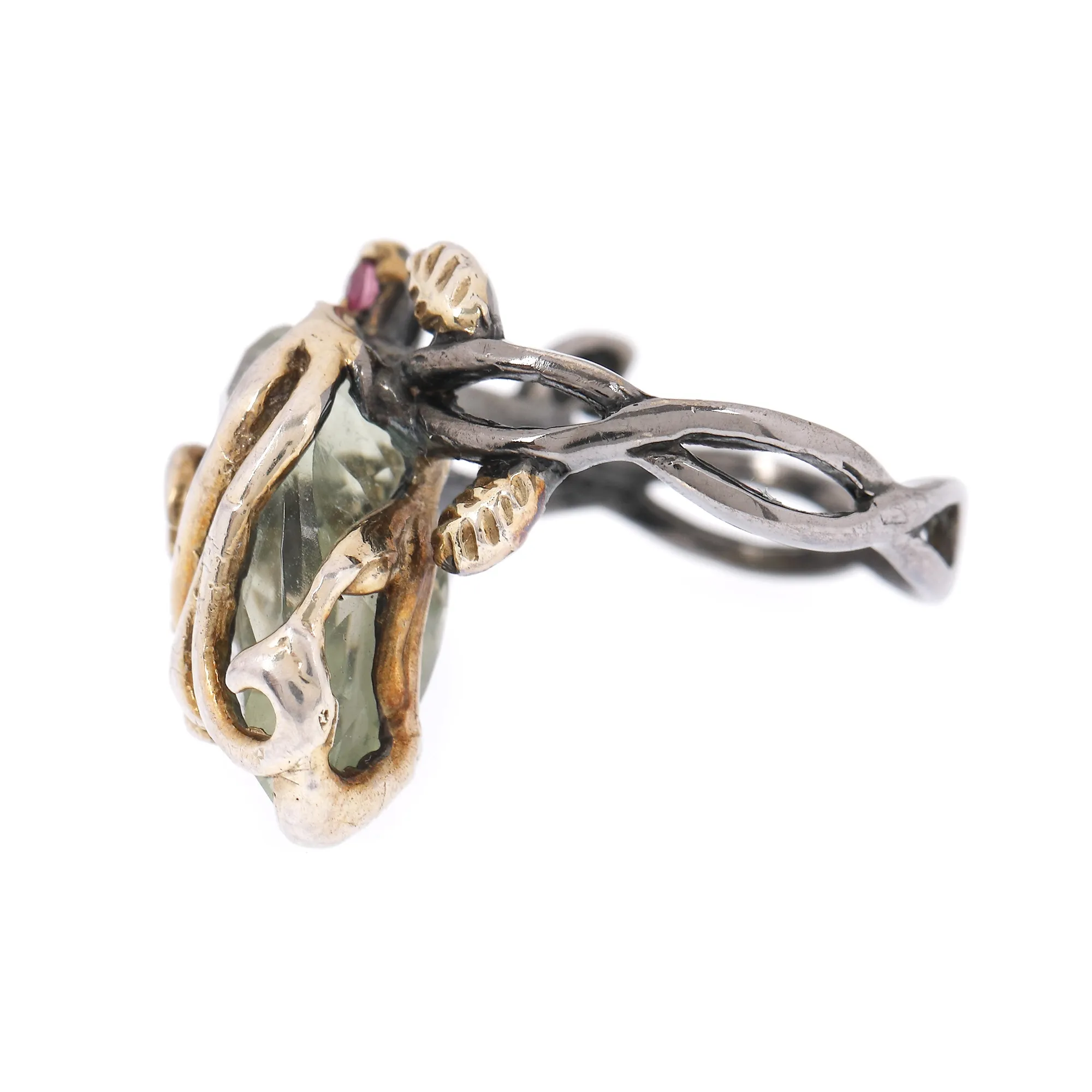 Silver ring decorated with prasiolite and rubies